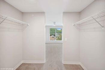 a room with two closets and a window in it